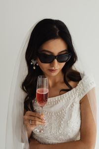 Kaboompics - Cat-Eye Sunglasses and Statement Earrings for a Modern Bride