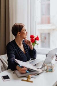 Kaboompics - Happy casual beautiful woman working on a laptop