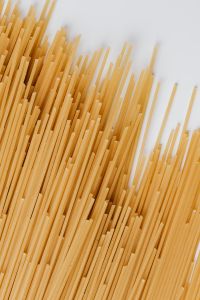 Kaboompics - Diagonal Spaghetti Sticks on White for Minimal Italian Recipe Styling