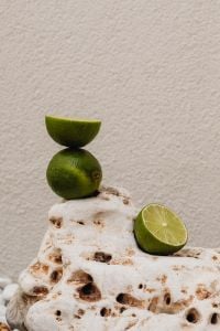 Kaboompics - Stacked Lemon and Lime Halves on Natural Stone