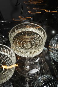 Kaboompics - Close-Up Champagne Coupe and Disco Ball with Golden Reflections
