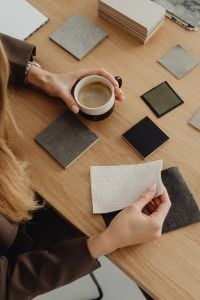 Kaboompics - Overhead of Coffee With Fabric, Tile and Wood Finish Samples