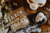 Kaboompics - Halloween Trick or Treat Sign with Crystal Skull and Candles