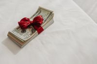 Kaboompics - Money Gift Aesthetic with Red Ribbon