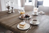 Kaboompics - Sweet dessert with cream an a cup of coffee on a table