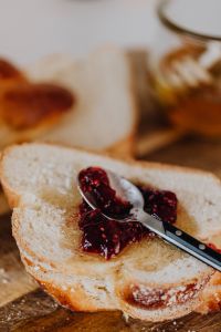 Kaboompics - Challah Toast With Raspberry Jam Spread and Spoon
