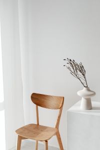 Kaboompics - Minimalist Interior with Wooden Chair and Dried Stems in White Vase