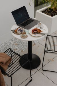 Kaboompics - Laptop Work Setup with Croissants and Coffee Outdoors