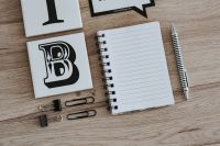 Kaboompics - Inspirational cards with quotes and a notebook