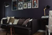 Kaboompics - Dark cozy couch with pillows in modern room interior