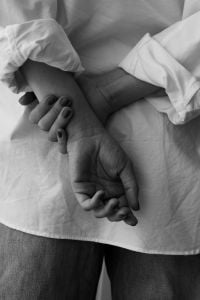 Kaboompics - Woman Holding Her Wrist in a Monochrome Fashion Portrait