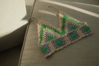 Kaboompics - Handmade Multicolor Crochet Halter Top Laid Flat on Gray Upholstery