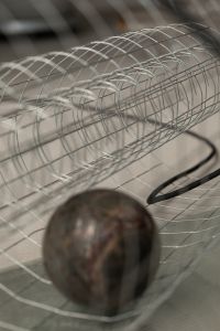 Kaboompics - Abstract Dark Sphere in Wire Cylinder Background