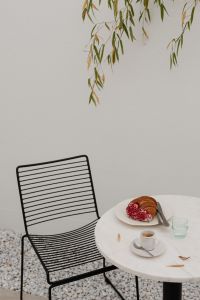 Kaboompics - Outdoor Coffeehouse Table with Croissant, Coffee and Water