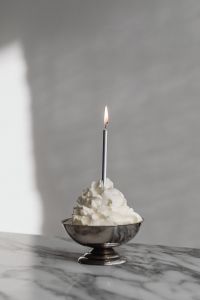 Kaboompics - Silver Bowl with Lit White Candle on Arabescato Marble