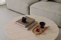 Kaboompics - Greige Sofa and Round Travertine Table with Kinfolk Book and Candle