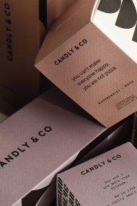 Kaboompics - Close-Up of Candle Packaging with Printed Brand Copy