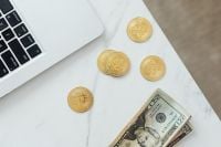 Kaboompics - Laptop, Bitcoin Tokens and US Dollar Bills