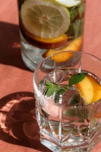 Kaboompics - Close-Up of Lemon Water Glasses With Mint and Fruit Slices