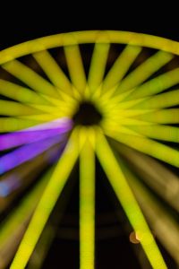 Kaboompics - Yellow-Green Ferris Wheel with Purple Lower Spokes