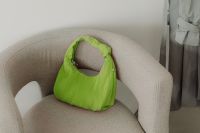 Kaboompics - Lime Green Handbag on a Modern Armchair