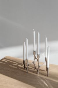 Kaboompics - Chrome Candelabra with White Candles on Wooden Table