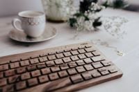 Kaboompics - Close-Up Wooden Keyboard and Coffee with Floral Details