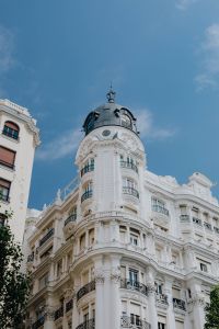 Kaboompics - Vertical Madrid Street View of a Domed Tower, White Facade and Trees