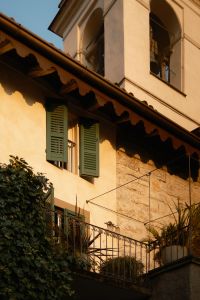Kaboompics - Italian Bell Tower Above a House With Green Shutters