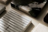 Kaboompics - White Ribbed Marble Texture with Green Stone Accents and Copy Space