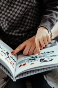 Kaboompics - Child reading a book