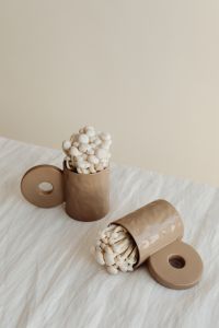 Kaboompics - White Mushrooms with Tipped Vessel and Decorative Discs