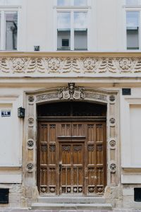 Kaboompics - Carved Wooden Door and Stonework in Krakow, Poland