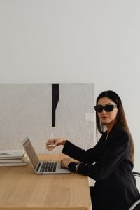 Kaboompics - Businesswoman with Laptop and Wine Glass in a Bright Interior
