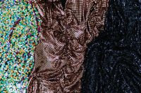 Kaboompics - Draped Bronze Mesh between Rainbow and Navy Sequin Fabric, Layered Background