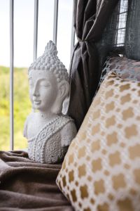 Cozy Balcony Decor with Patterned Cushions, Tea and Flowers
