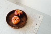 Kaboompics - Peaches in Wooden Bowl on White Stone Table, Bright Food Still Life