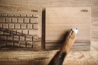 Kaboompics - Dogs paw on the wooden keyboard