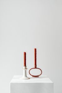 Kaboompics - Red Taper Candles in White and Rust Holders