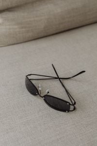 Kaboompics - Black Sunglasses on a Neutral Sofa