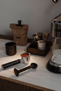 Kaboompics - Coffee Tools, Paper Coffee Bag and Espresso Machine Still Life