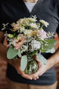 A small pastel bouquet in a glass vase