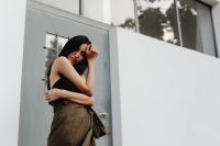 Kaboompics - Asian Fashion Portrait with Hand near Face, Black Top and Brown Wrap Skirt