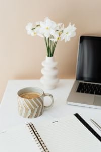 Kaboompics - Open Notes Journal, Coffee and White Flowers beside Laptop