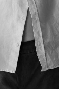 Kaboompics - Open White Shirt Styled With Black Trousers in Monochrome