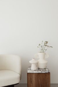 Kaboompics - Minimalist Armchair and Ceramic Vases against Bright Neutral Wall