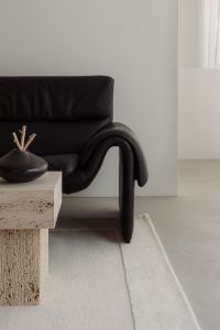 Kaboompics - Black Sofa with Travertine Table and Black Bowl