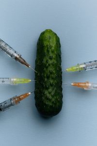 Kaboompics - Syringes Surrounding a Cucumber