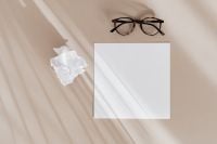 Kaboompics - Blank Card and Eyeglasses with Shadow Lines on Beige Background