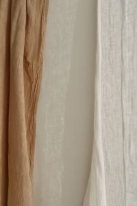 Kaboompics - Layered Beige and Sheer Curtains with Soft Window Light, Neutral Interior Background